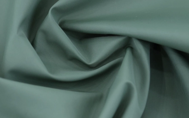 Green woven fabric sample representing custom fabric development