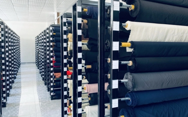 Fabric roll library supporting woven fabric sourcing and sample review