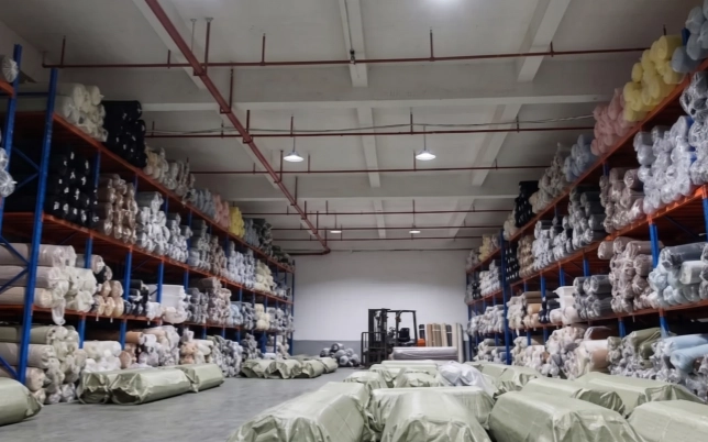 Fabric rolls stored for coordinated bulk supply