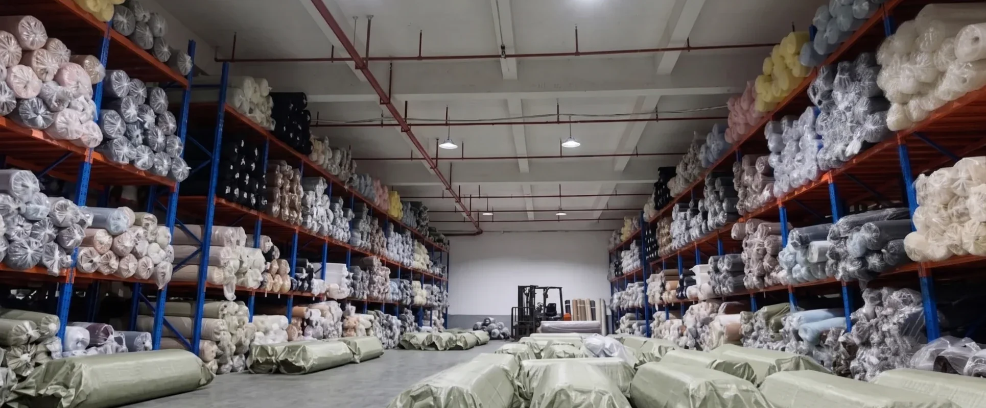Fabric buyer reviewing sustainability claims, recycled-content documents and textile certifications for European sourcing